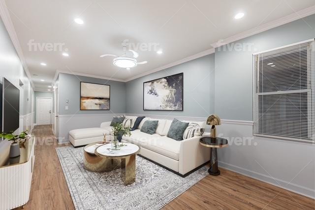 living room with wood-type flooring and ornamental molding