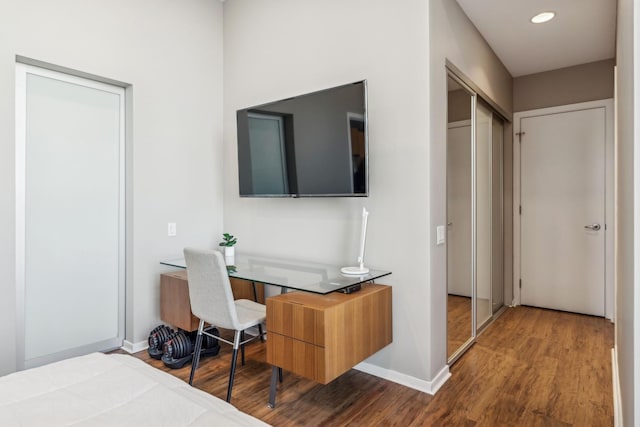 bedroom featuring a closet and wood-type flooring