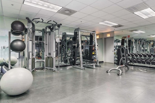 exercise room with a drop ceiling