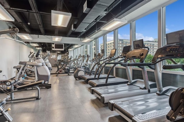 workout area featuring a wall of windows