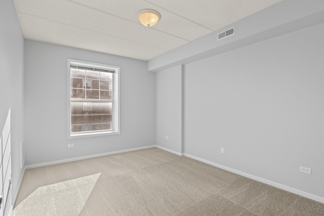 empty room with light colored carpet