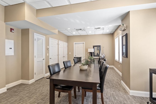 dining space featuring carpet flooring and electric panel