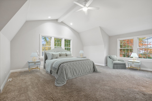 carpeted bedroom featuring vaulted ceiling with beams, ceiling fan, multiple windows, and baseboards