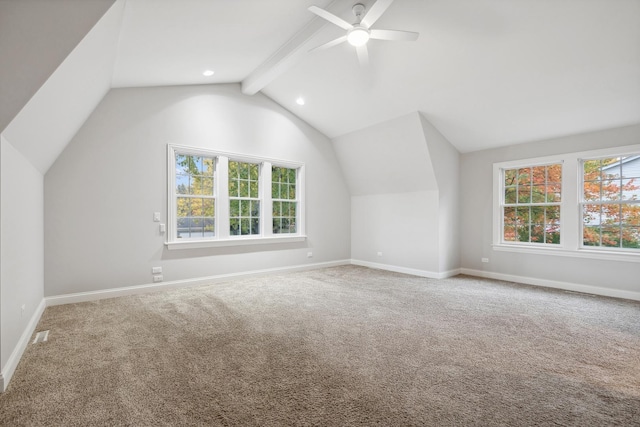 additional living space featuring carpet floors, ceiling fan, lofted ceiling with beams, and baseboards