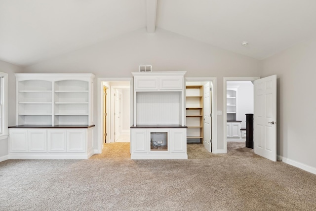 unfurnished living room with lofted ceiling with beams, baseboards, light carpet, and visible vents