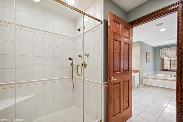 bathroom featuring separate shower and tub and tile patterned floors