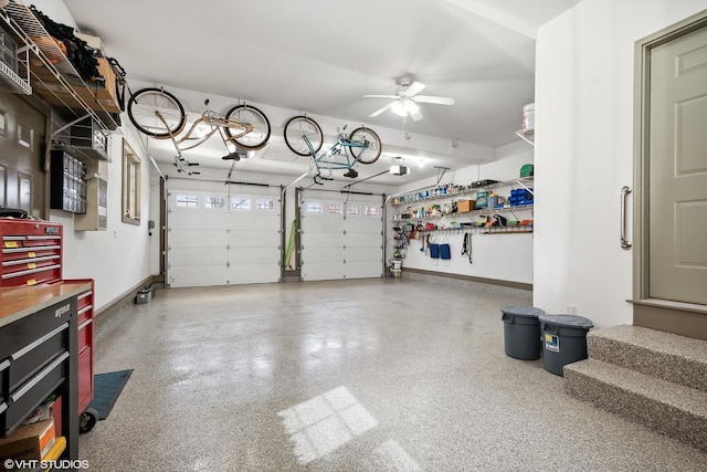 garage with ceiling fan and a garage door opener