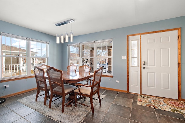 dining area featuring a chandelier and plenty of natural light