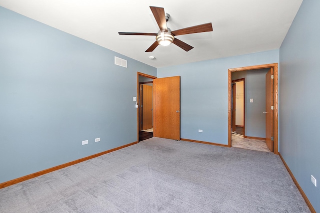 unfurnished bedroom with ceiling fan and light carpet