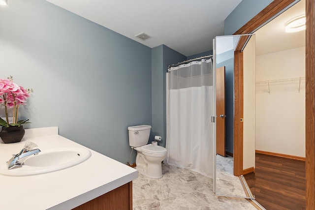 bathroom with toilet and vanity