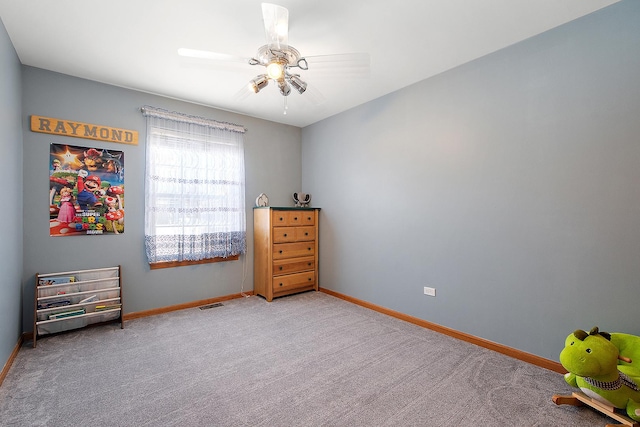 unfurnished bedroom with ceiling fan and light colored carpet