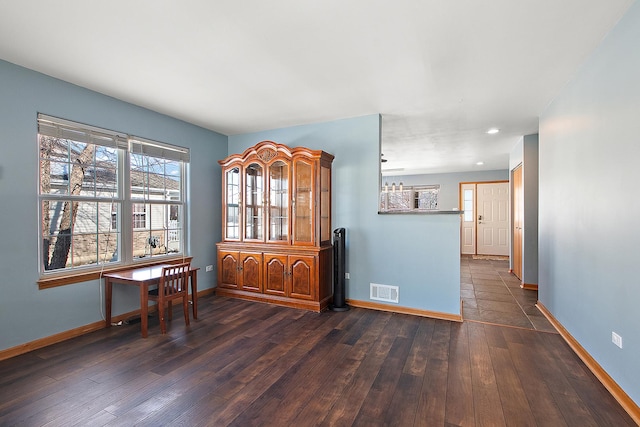 empty room featuring dark wood-type flooring