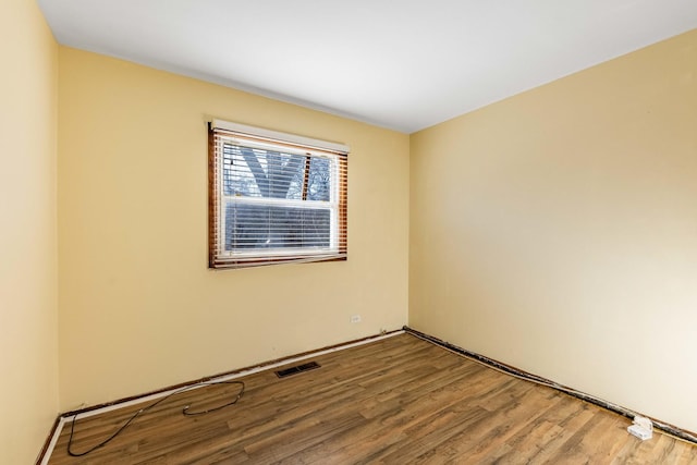 empty room featuring hardwood / wood-style flooring