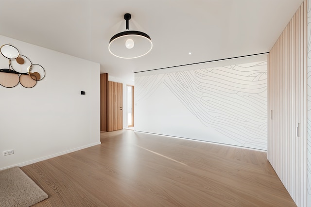 spare room featuring light hardwood / wood-style flooring