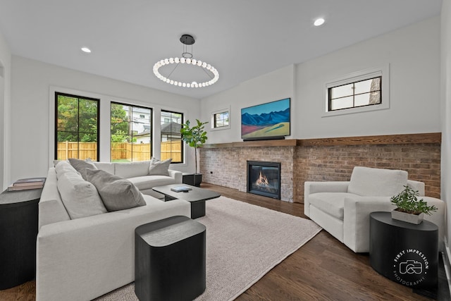 328 S Loomis St, Naperville, IL 60540 - living room with dark wood-style floors, a brick fireplace, and recessed lighting