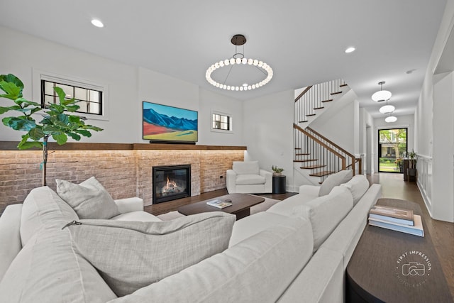 328 S Loomis St, Naperville, IL 60540 - living area featuring wood finished floors, stairway, a glass covered fireplace, and recessed lighting