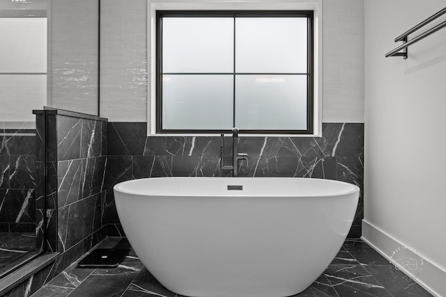 328 S Loomis St, Naperville, IL 60540 - bathroom with marble finish flooring, tile walls, and a freestanding bath