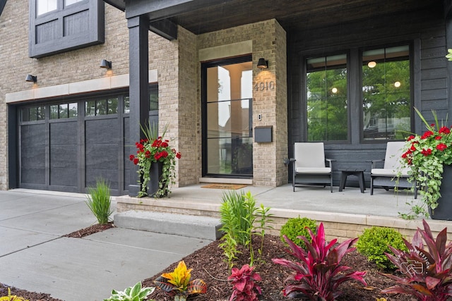 328 S Loomis St, Naperville, IL 60540 - view of exterior entry featuring a porch and concrete driveway