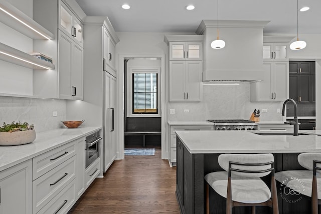328 S Loomis St, Naperville, IL 60540 - kitchen with recessed lighting, dark wood-style floors, backsplash, white cabinets, and hanging light fixtures