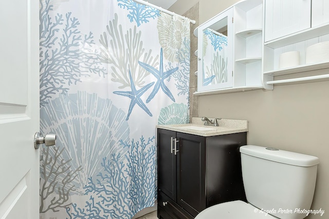 bathroom with vanity and toilet