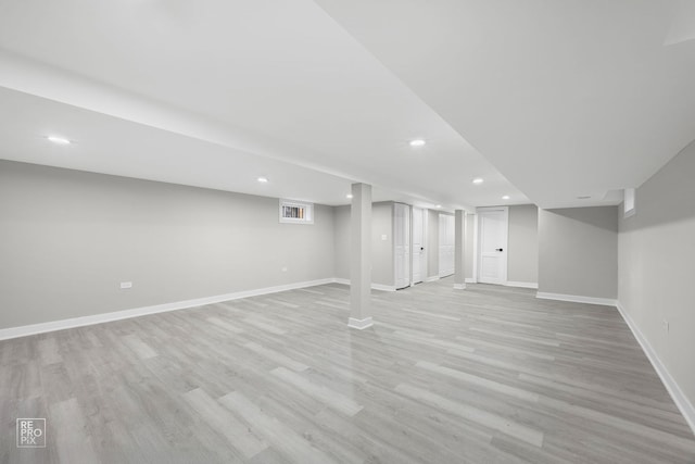 basement featuring light hardwood / wood-style floors