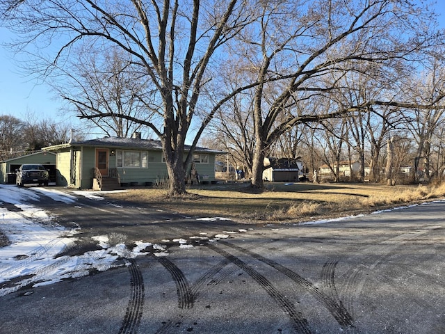 view of front of home featuring a carport