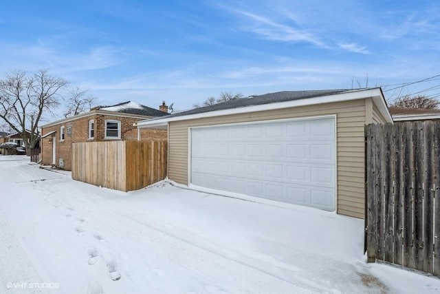 view of snow covered garage