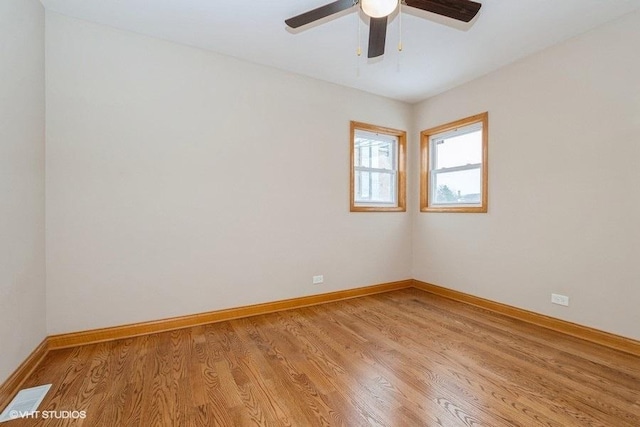 spare room featuring ceiling fan and light hardwood / wood-style flooring