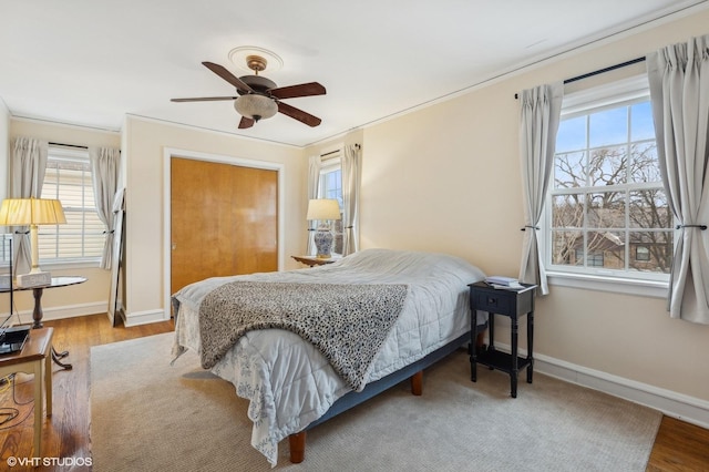 bedroom featuring light hardwood / wood-style floors and ceiling fan