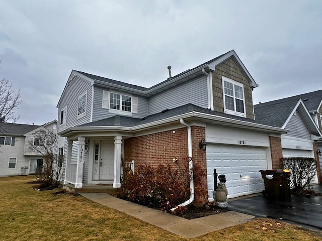 view of front of home with a garage and a front yard