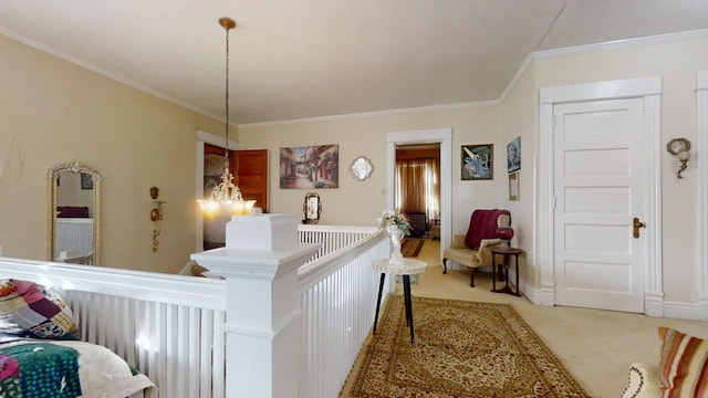 interior space with a notable chandelier, carpet, and crown molding