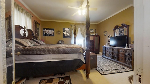 bedroom featuring crown molding, carpet flooring, and ceiling fan