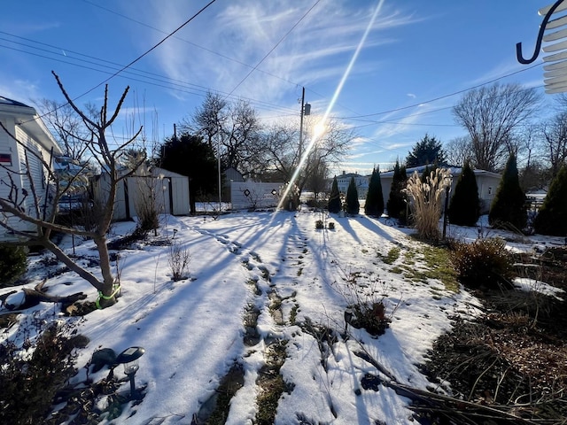 view of yard layered in snow