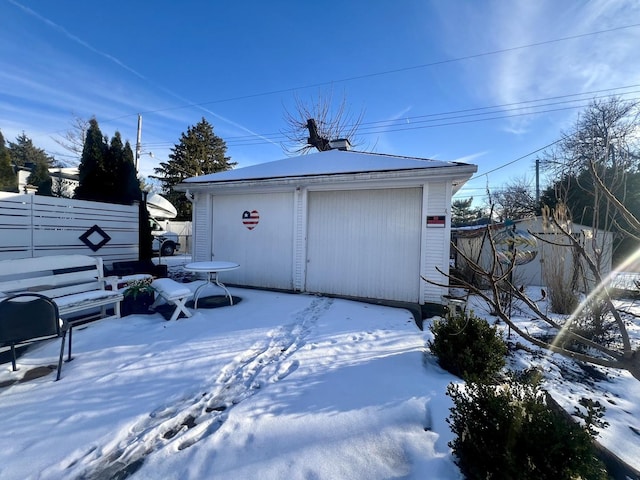 view of snow covered garage