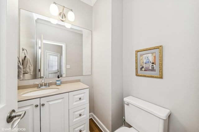 bathroom with toilet and vanity