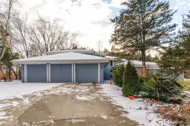 view of snow covered garage