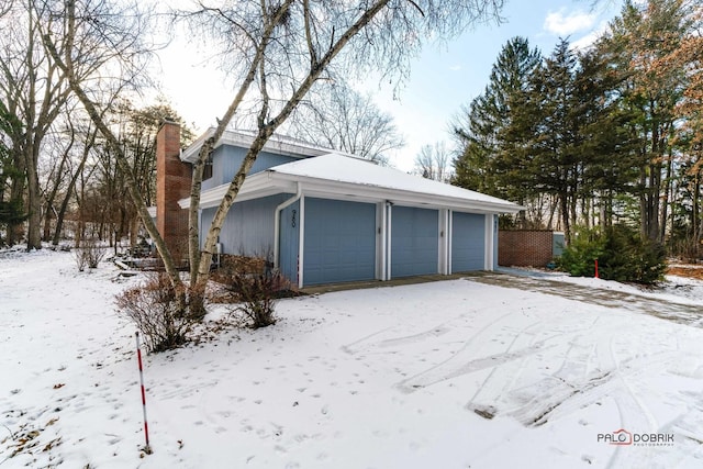 view of snow covered garage