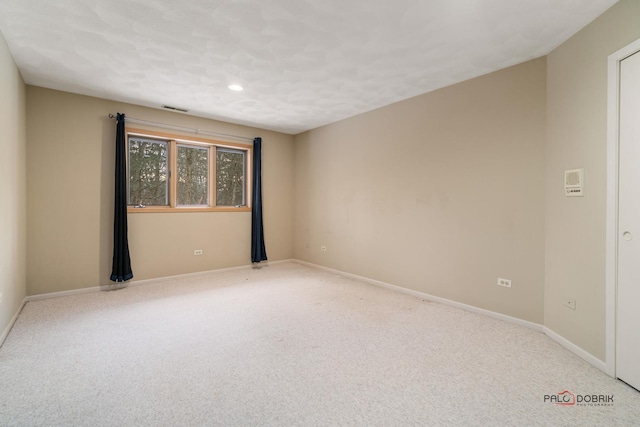 empty room featuring carpet floors