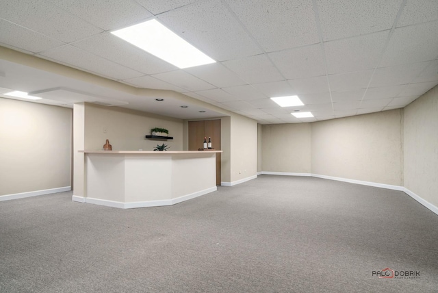 interior space with carpet and a drop ceiling