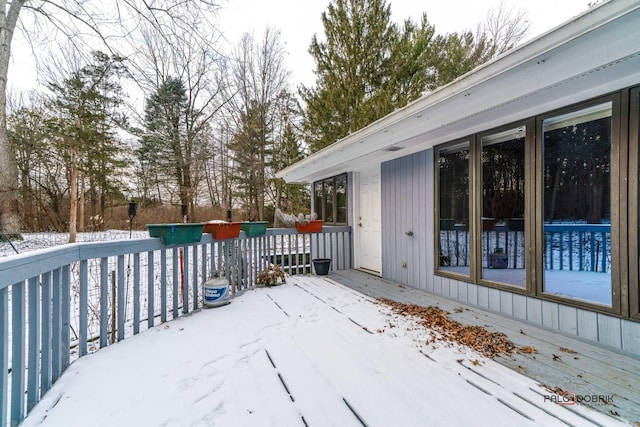 view of snow covered deck