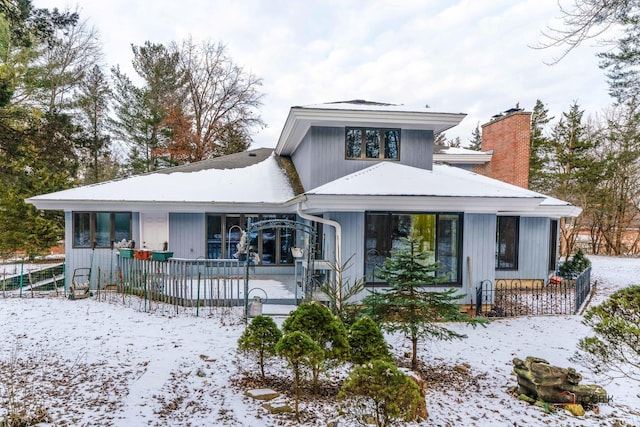 view of snow covered house