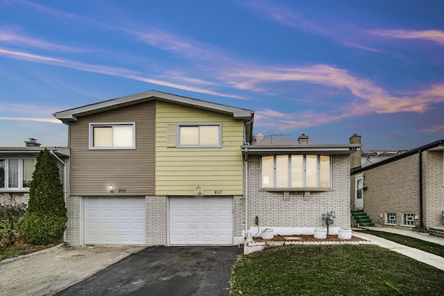 view of front of home with a garage