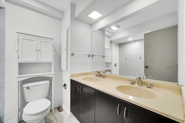 bathroom featuring tile patterned floors, vanity, and toilet