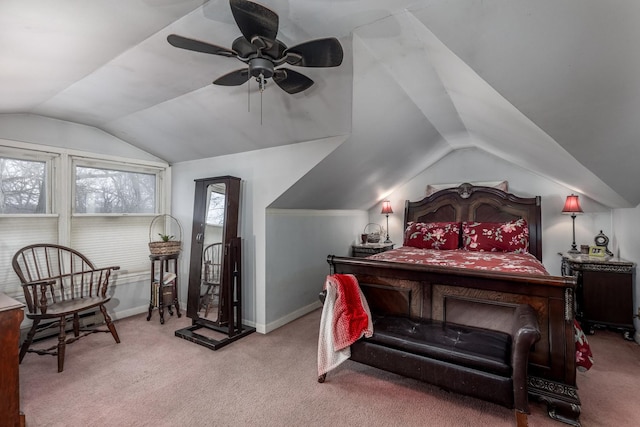 bedroom featuring vaulted ceiling, carpet flooring, baseboards, and ceiling fan