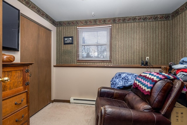 sitting room featuring a baseboard heating unit, baseboards, carpet, and wallpapered walls