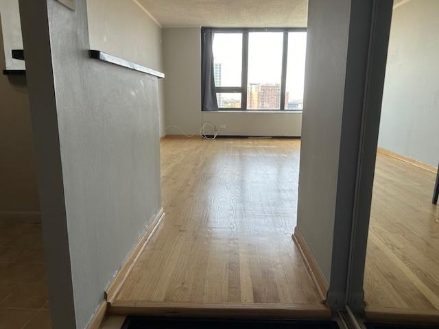 spare room featuring light hardwood / wood-style floors