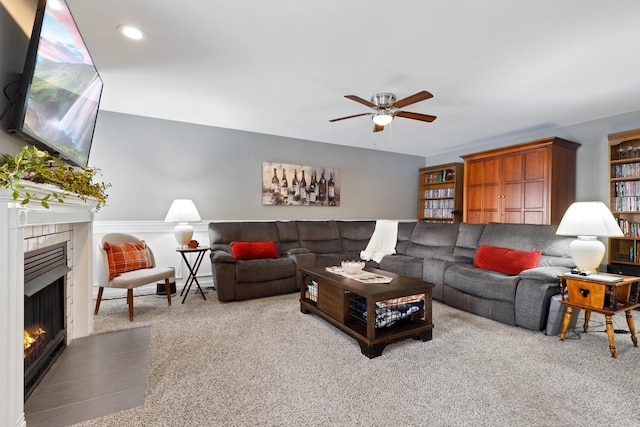 living room featuring light carpet and ceiling fan