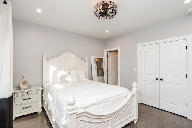 bedroom featuring dark hardwood / wood-style flooring and a closet