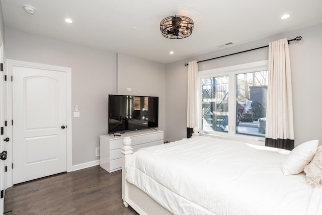 bedroom with dark wood-type flooring