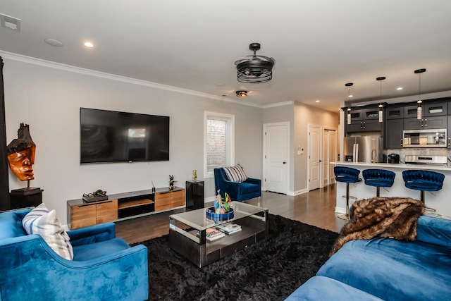 living room featuring dark hardwood / wood-style floors and crown molding